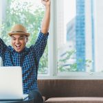 Happy guy at laptop