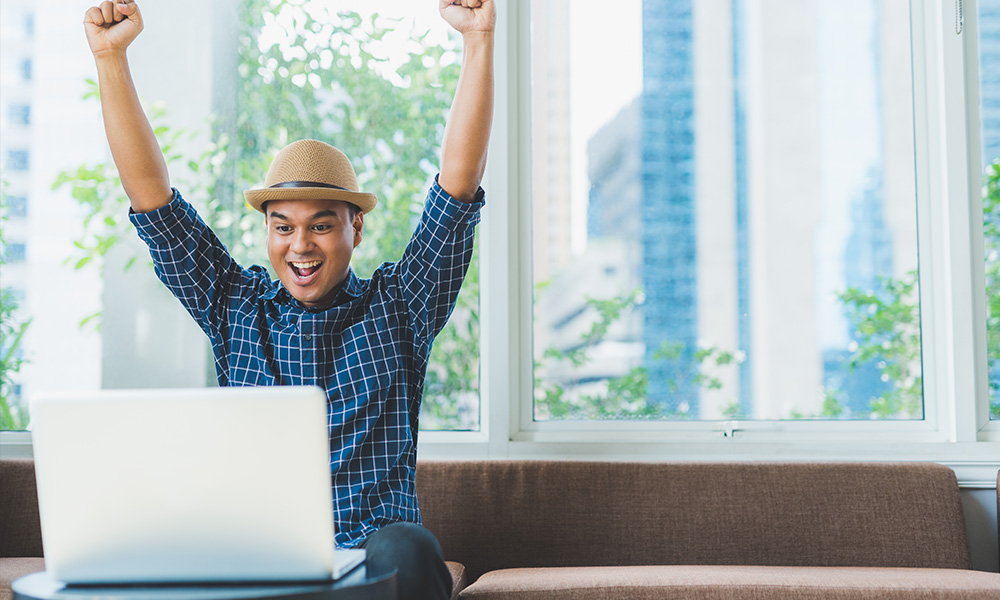 Happy guy at laptop